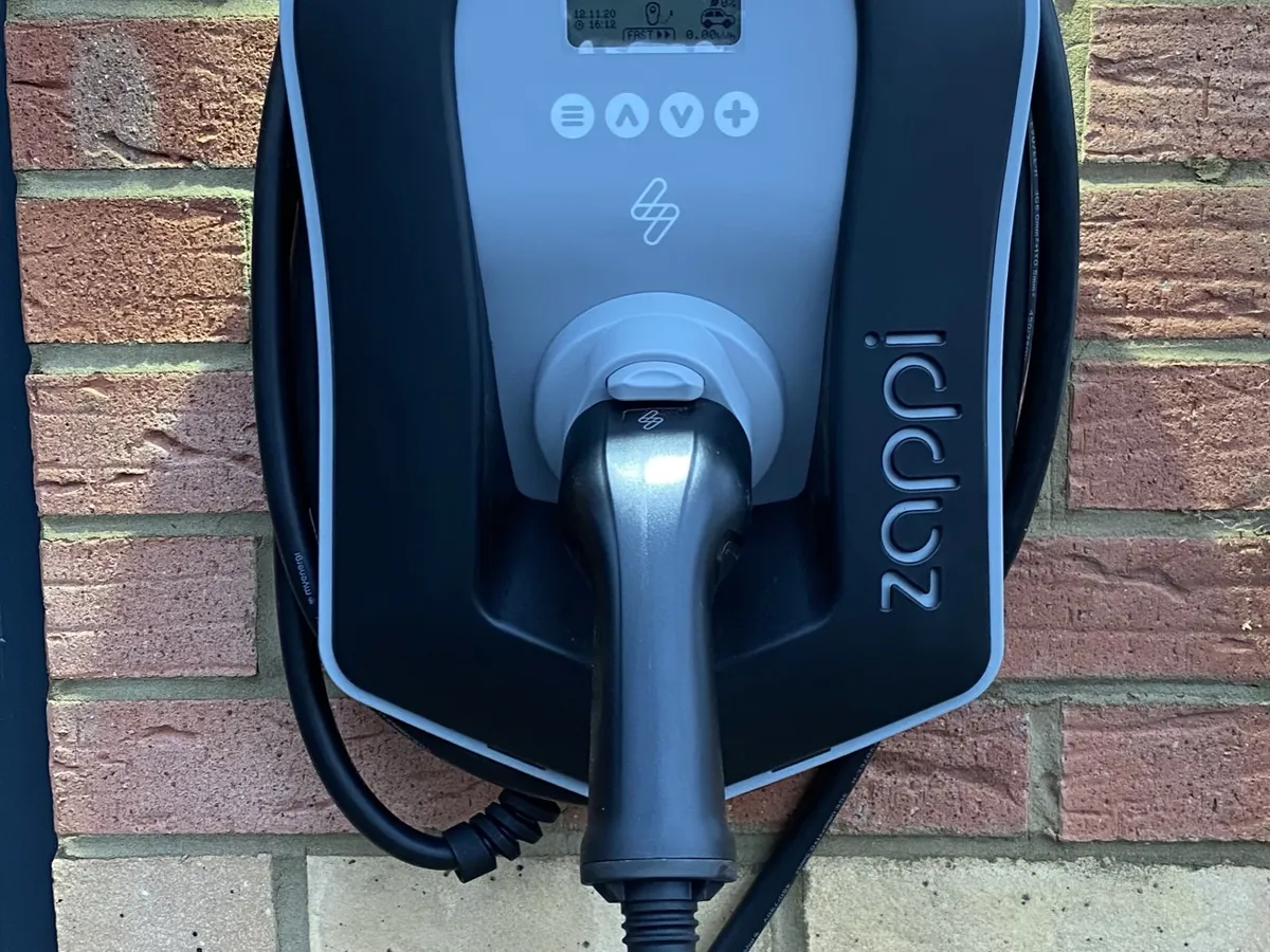 myenergi zappi EV charger installed by SEG on a brick wall