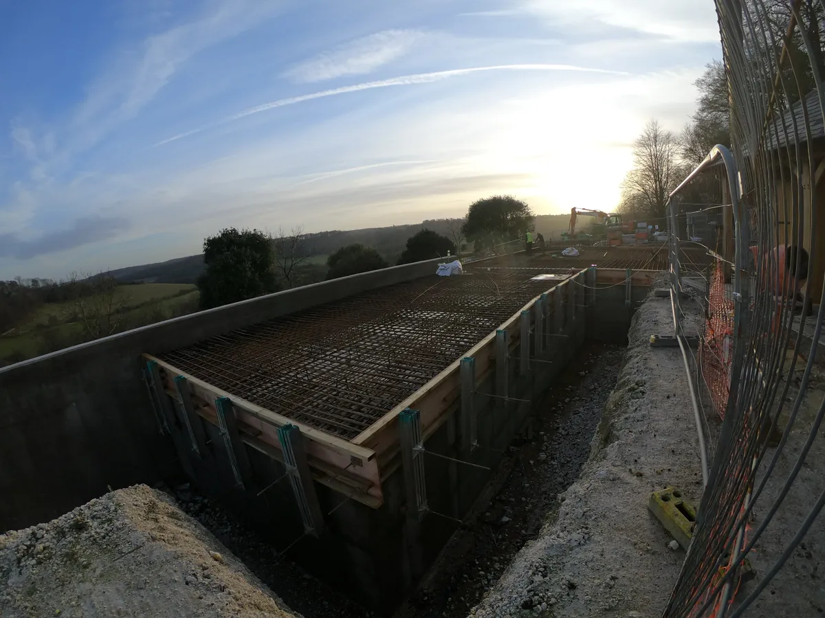 Reinforcement and shuttering on a construction site at sunset