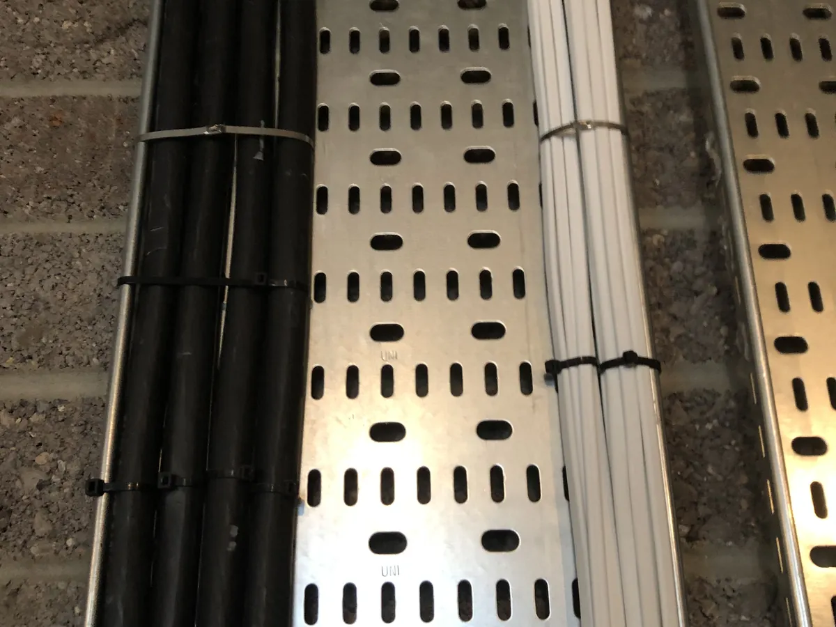 Galvanised perforated cable tray with bundled conduit