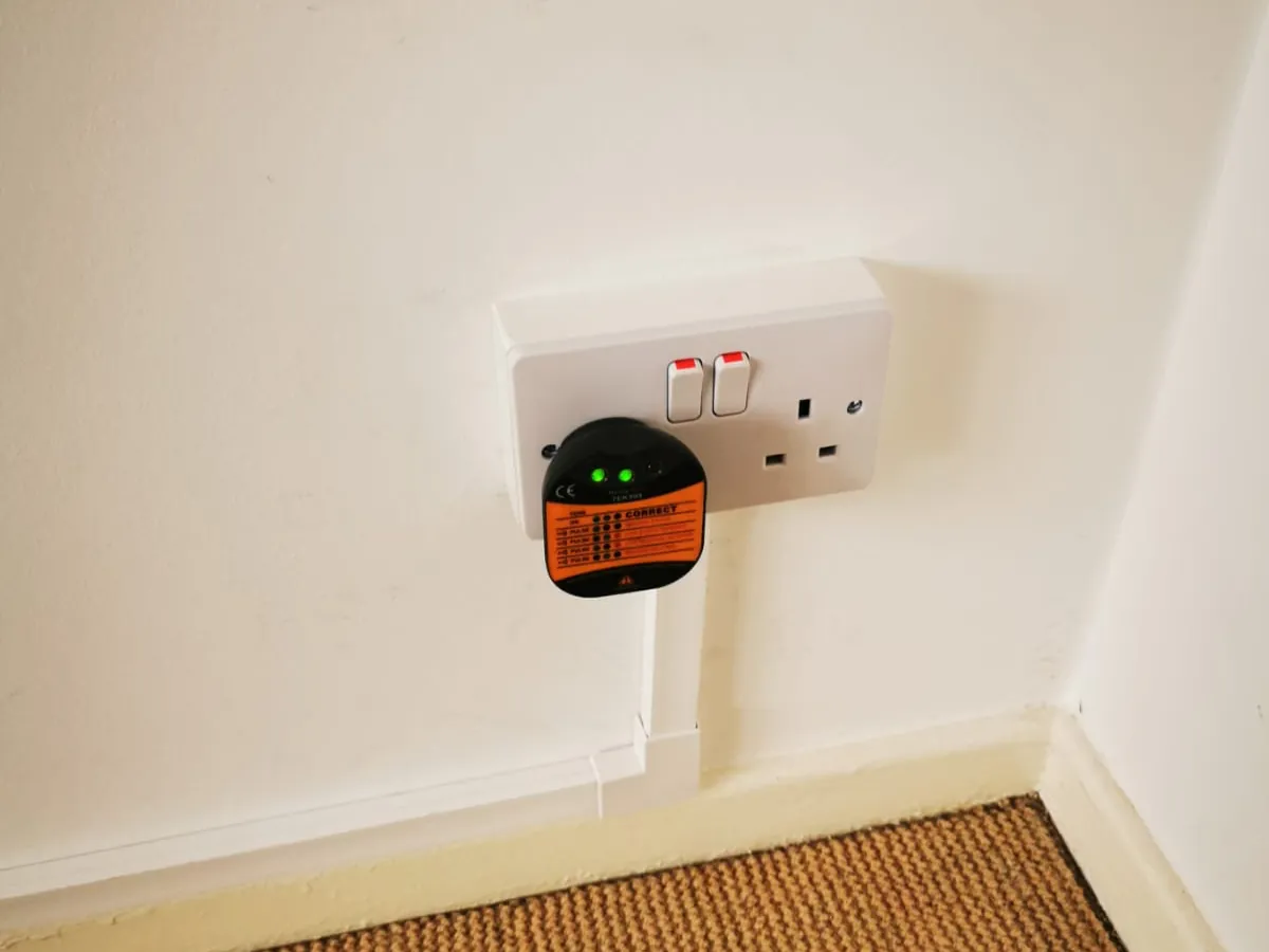 Double plug socket on a wall