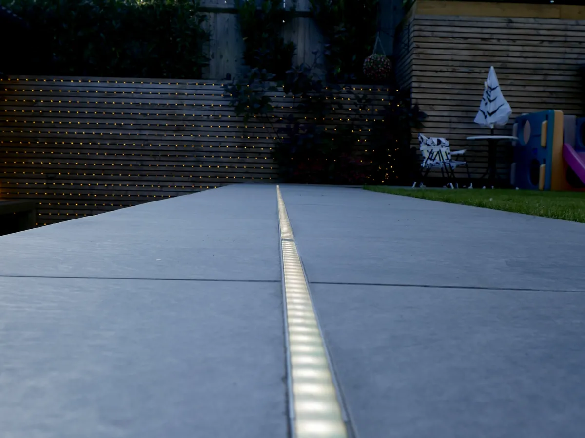 Recessed LED channel in a patio at dusk