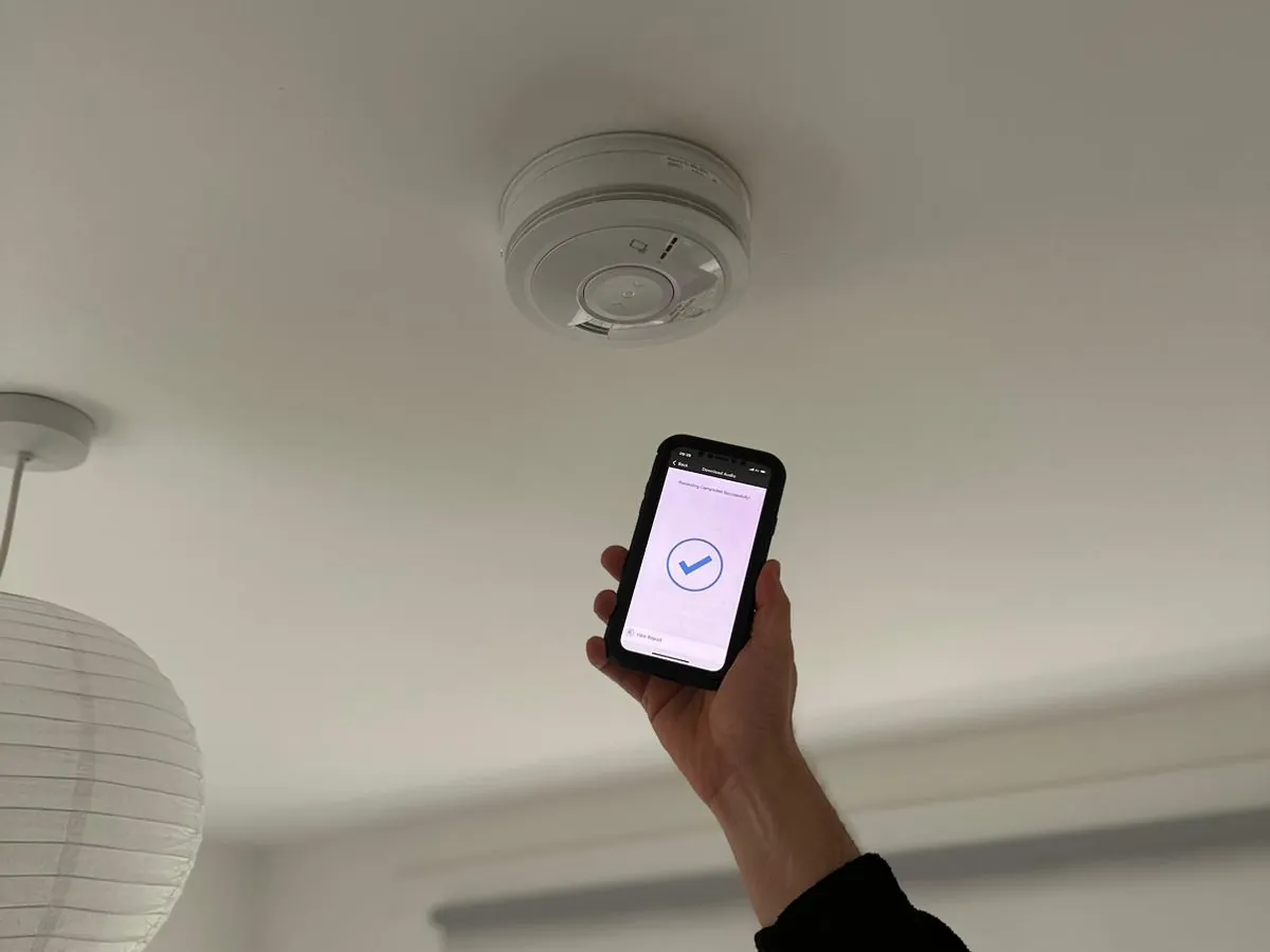 Phone app confirming a successful smoke alarm test