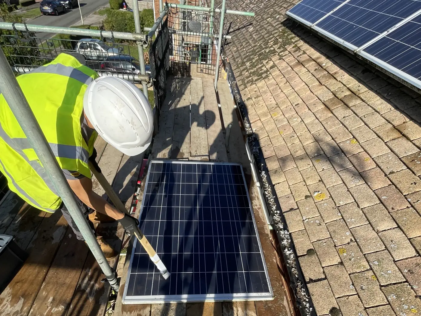 SEG engineer installing a solar panel