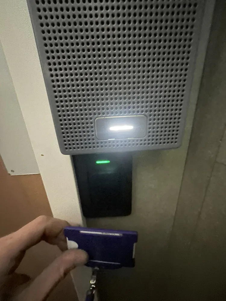 Card presented to an access control reader on an industrial unit door