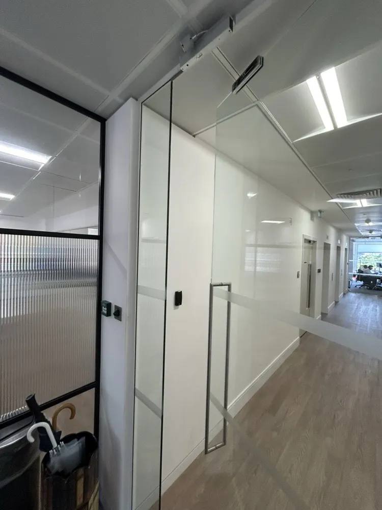 Card reader beside a glass door in a London office