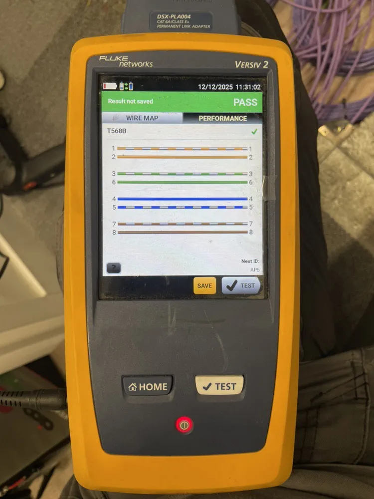 Cable tester showing a pass on a Cat6 link