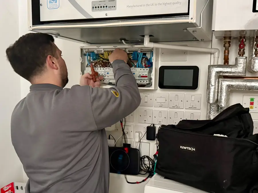 SEG engineer testing circuits at the consumer unit in a flat