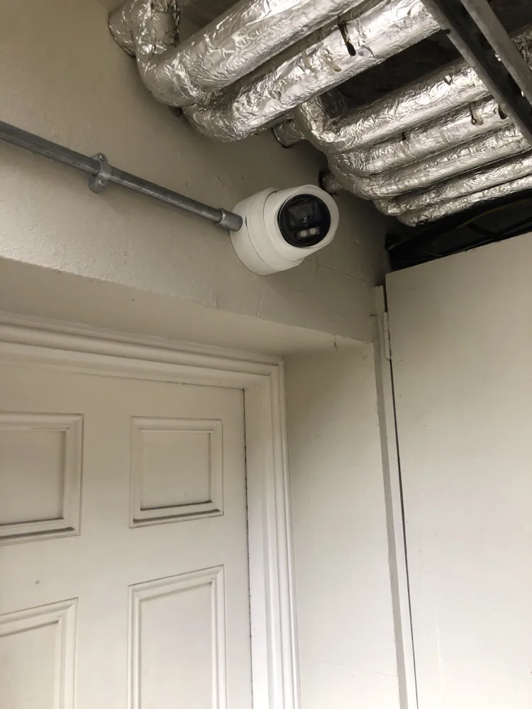 CCTV camera covering a basement door