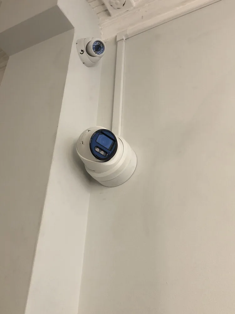 Dome CCTV camera on a wall in a residential building
