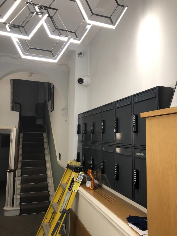 Lobby of a residential building with CCTV cameras