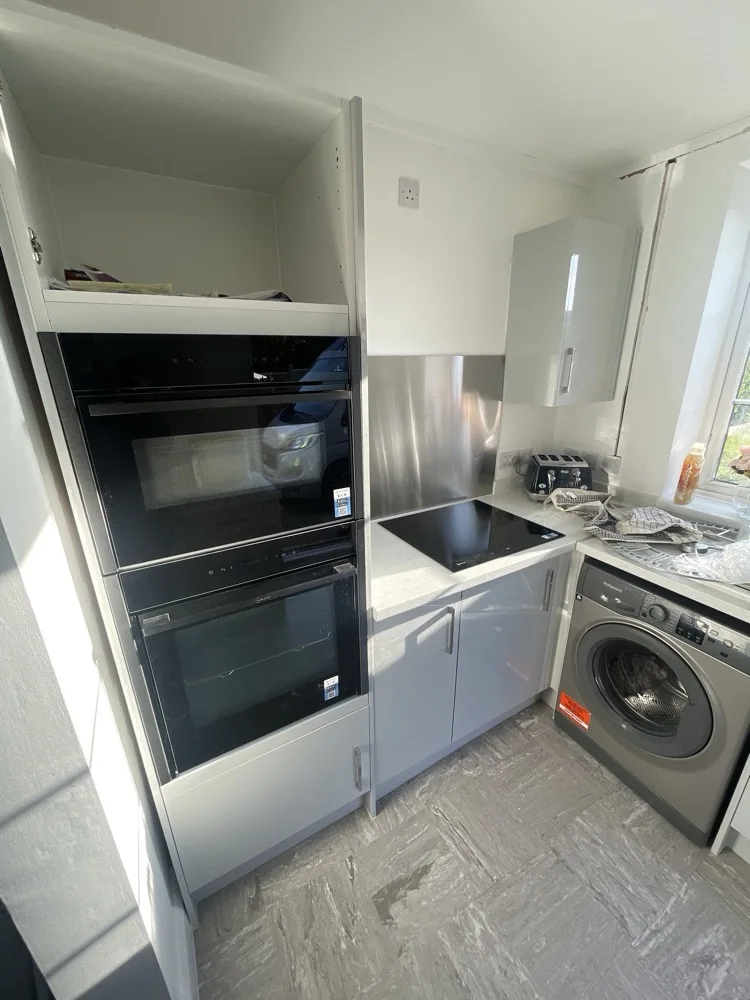Finished kitchen with built-in oven and microwave and a new hob in Welwyn Garden City