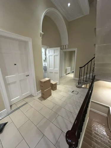 The entrance hall: a listed Georgian interior, so every route is planned around it