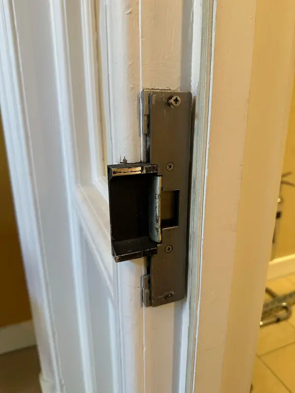 The old electric strike in the door frame, before the changeover
