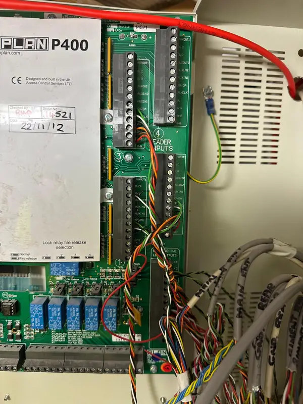 One of the old access control controllers, dated November 2012, before it is replaced