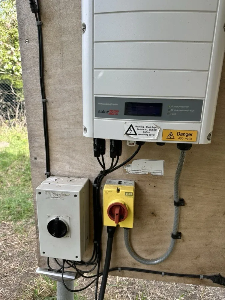 Inverter with AC and DC isolators on the backboard