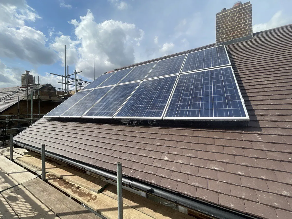 Solar panels refitted on a new tiled roof in Welwyn Garden City