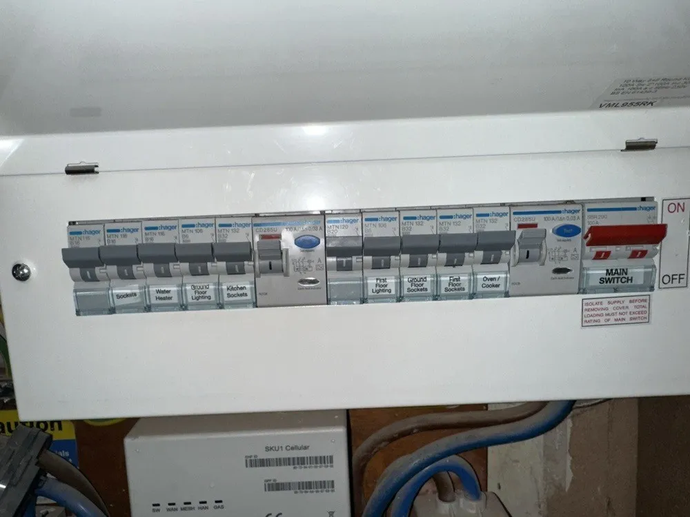 Dual-RCD consumer unit with labelled circuits, including the water heater