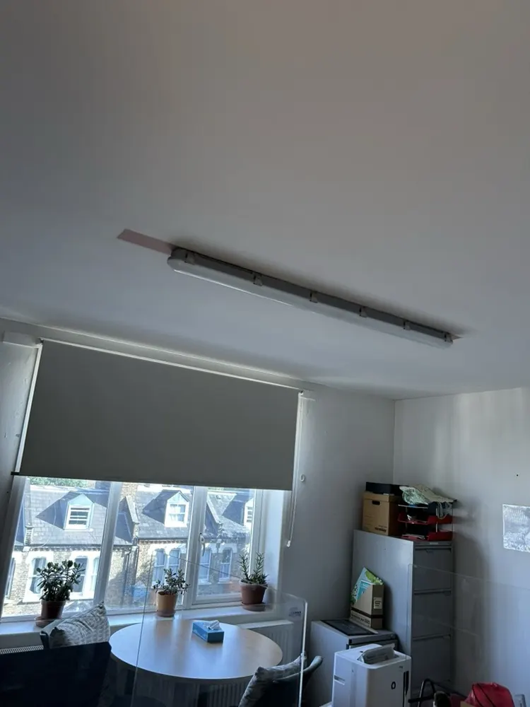 Before: one of the old fluorescent fittings in an office