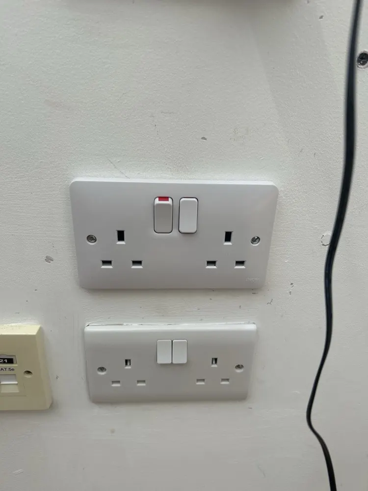 An extra double socket added beside the existing one