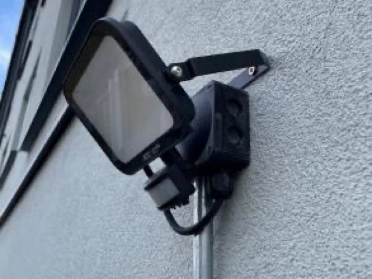 New PIR floodlight on a freshly insulated wall in Kempston