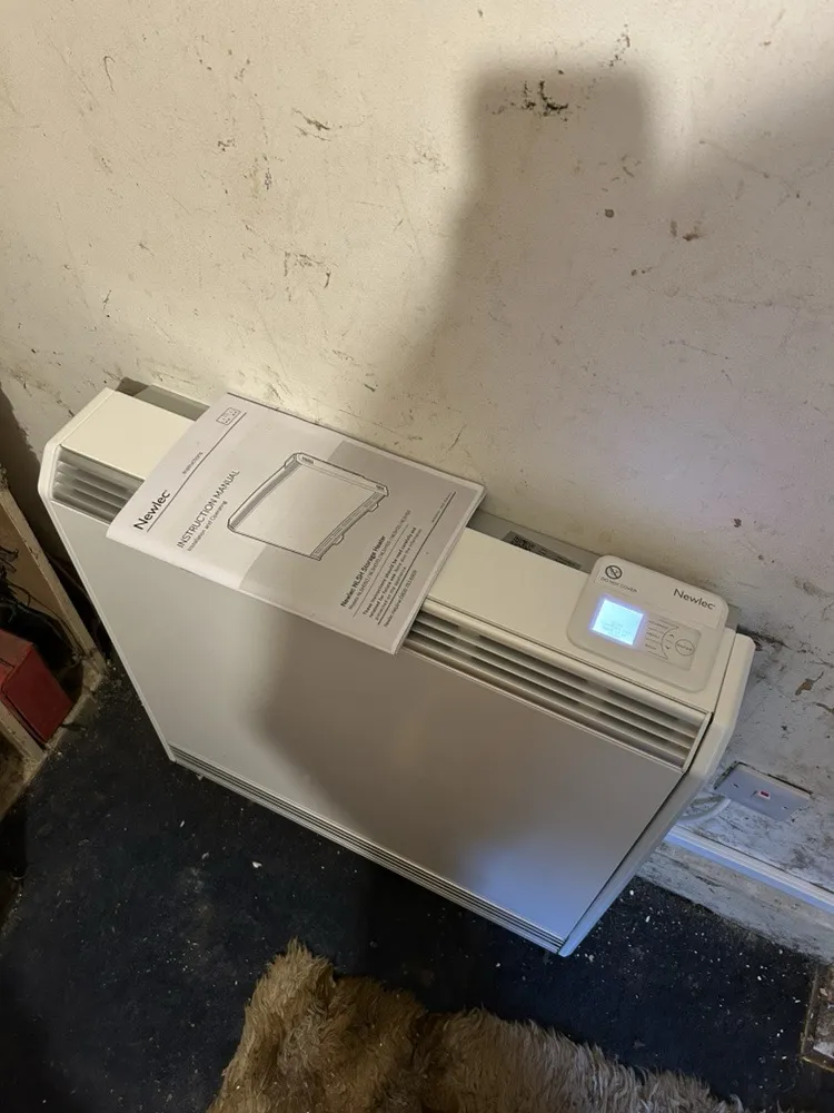 New Newlec storage heater installed in a St Albans flat with its manual