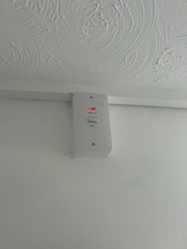 New 45A shower isolator switch on a ceiling