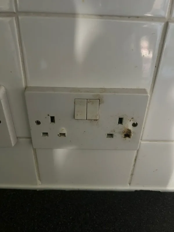 Burnt double socket in a kitchen