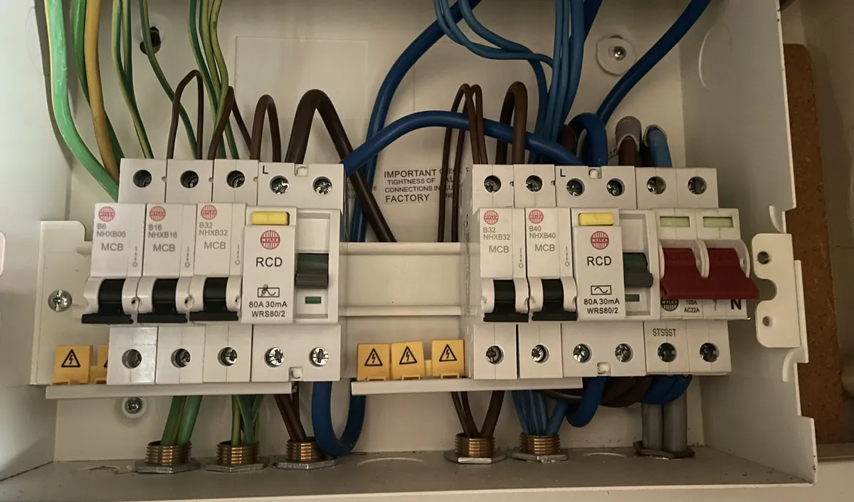 Dual-RCD consumer unit with its cover off, wired and ready for testing, in a Stevenage home